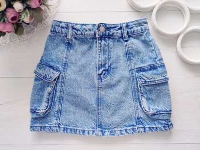 7,8 років, зріст 128 Блакитна дитяча джинсова спідниця з накладними кишенями